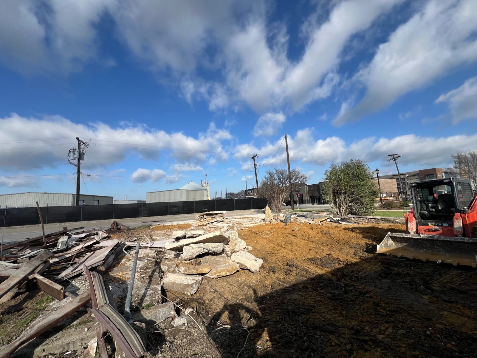 Debris being cleared from a lot