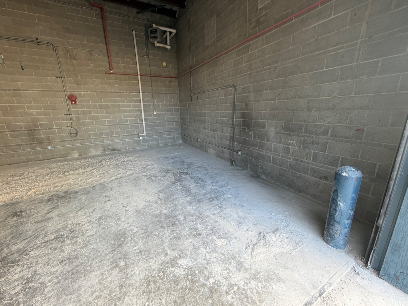 Concrete floor cleared after equipment removal